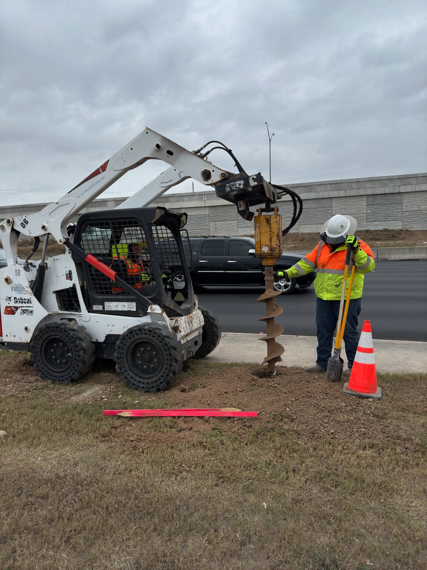 Republic Traffic Safety sign post installation using Bobcat skid steer Houston
